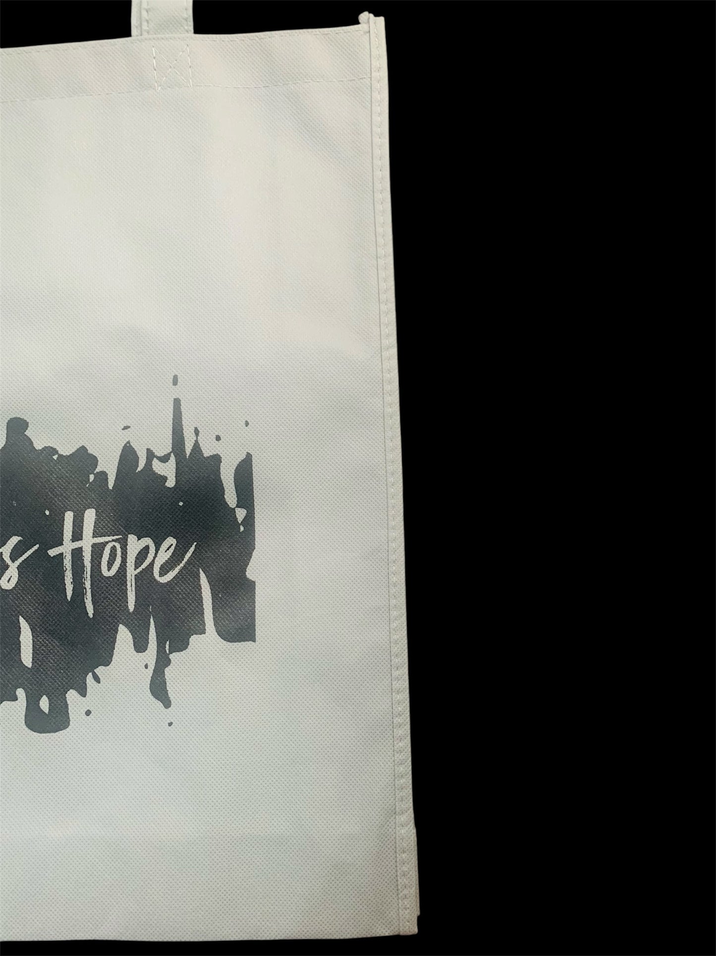 Eco friendly grey bag with black endless hope design on the front.