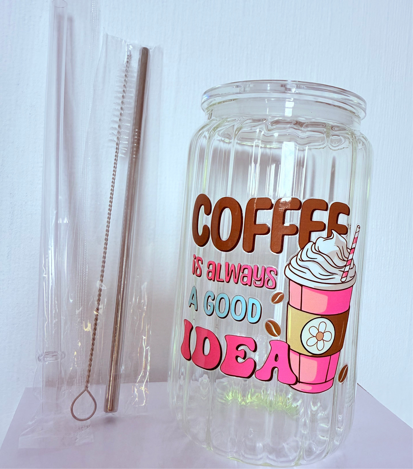 Drinking glass with straws, choice of designs.
