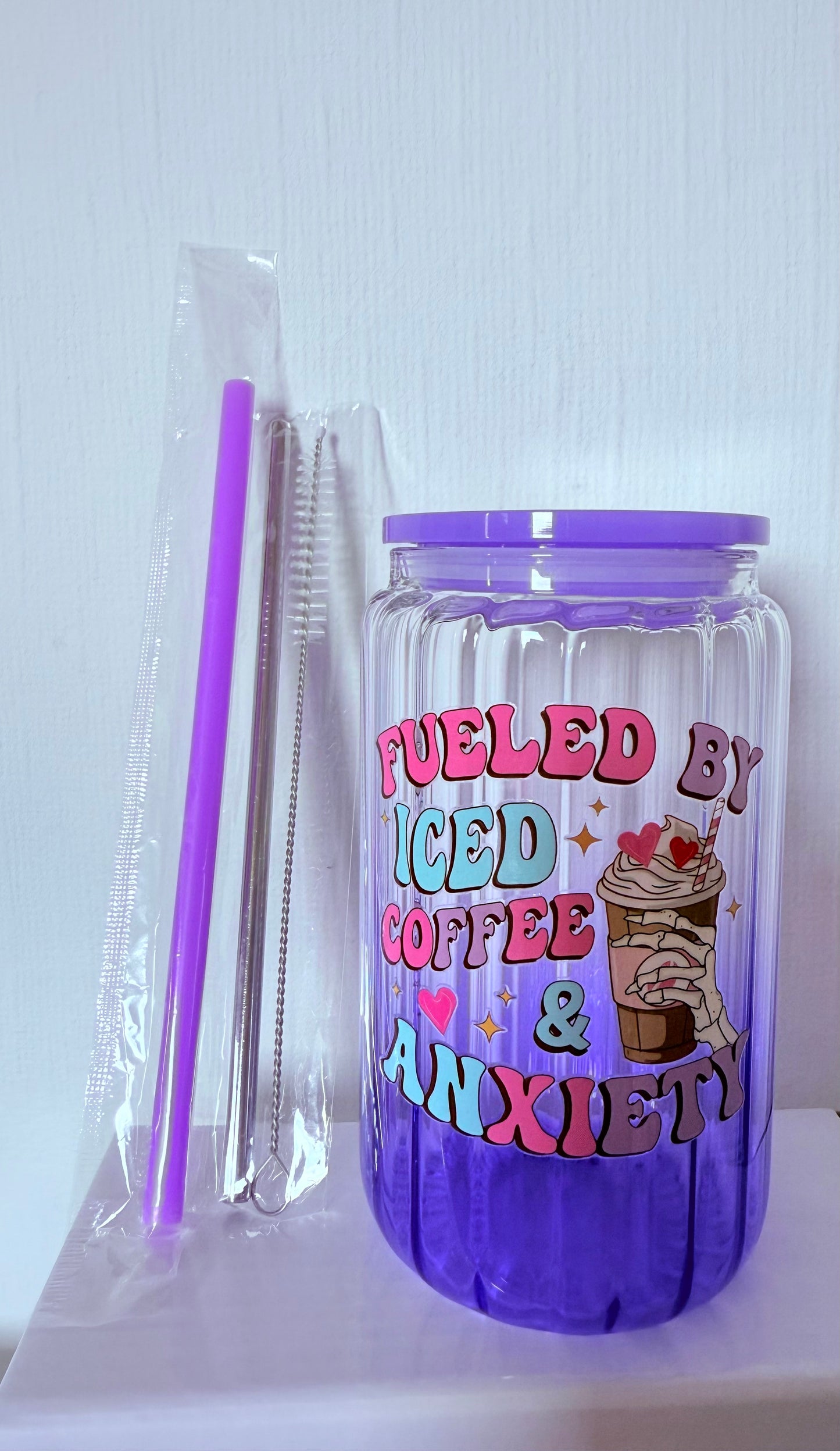 Drinking glass with straws, choice of designs.