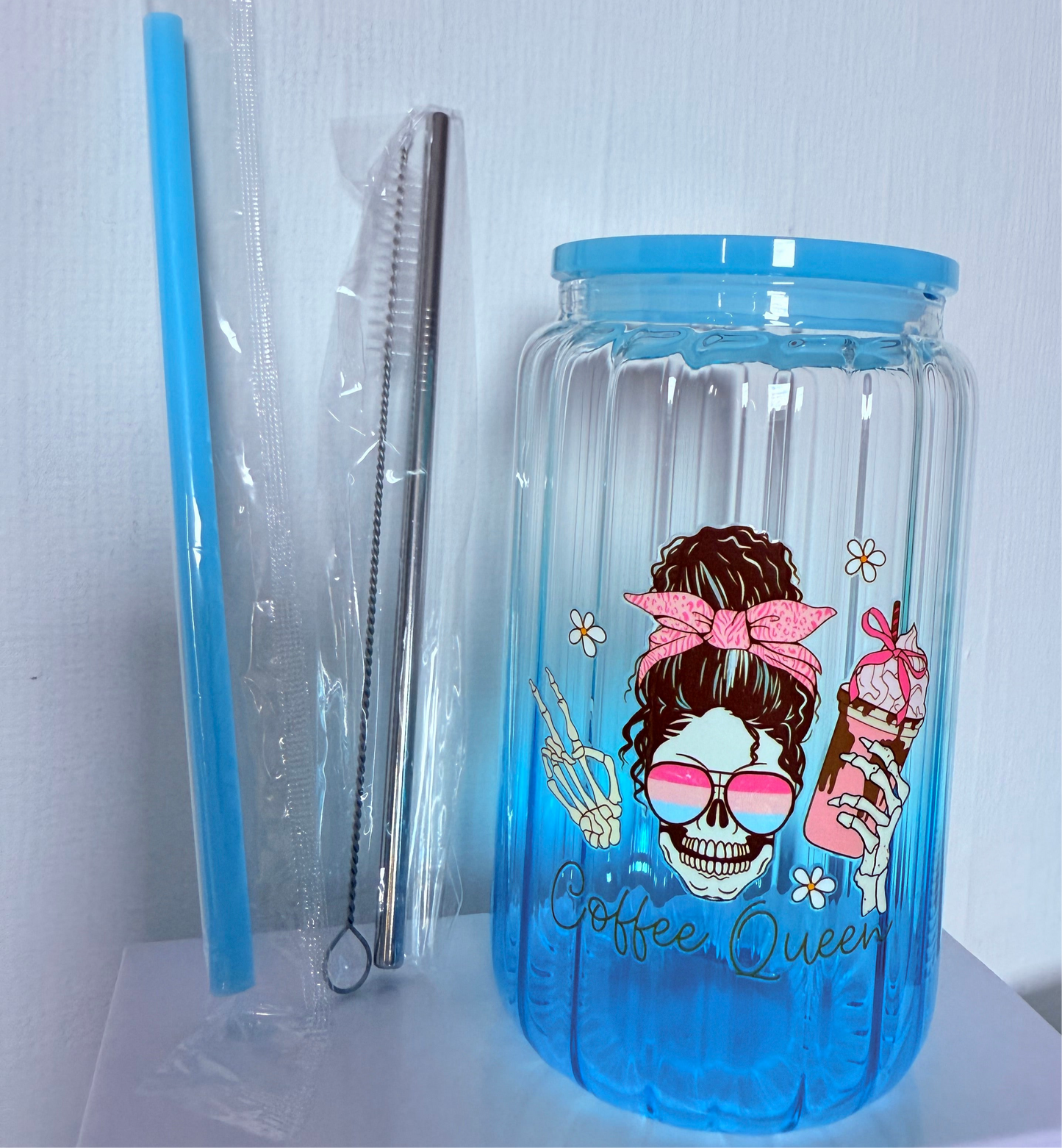 Drinking glass with straws, choice of designs.