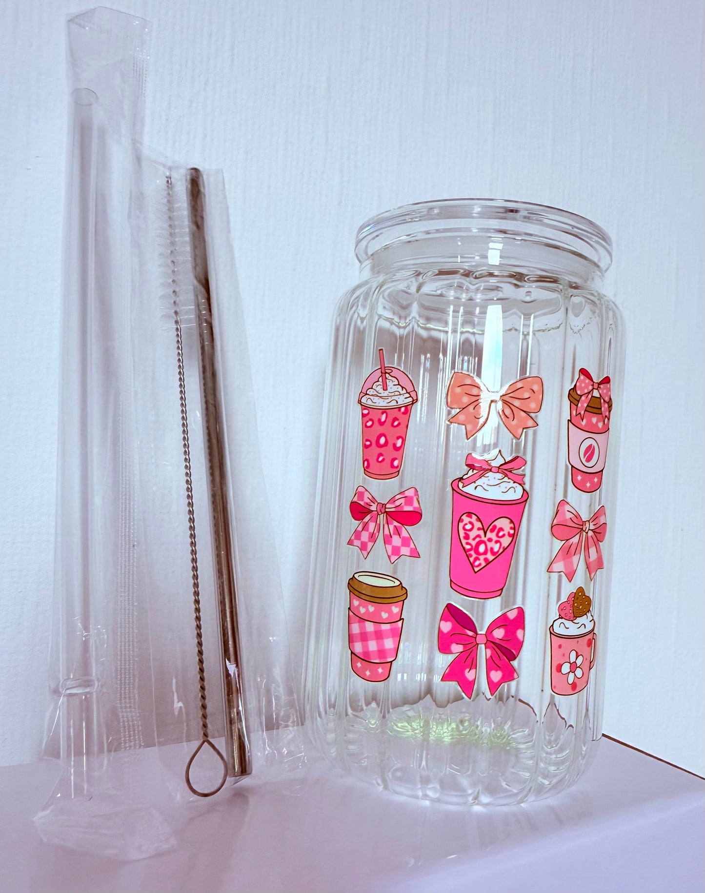 Drinking glass with straws, choice of designs.